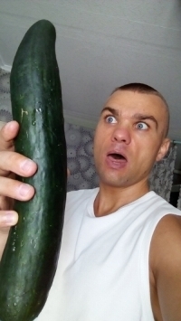 The man with a large cucumber